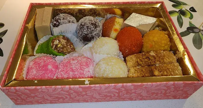 Assorted Indian mithai box with barfi, ladoo and coconut sweets at Lovely Sweets Calgary